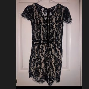 Black Lacey romper nude underneath.